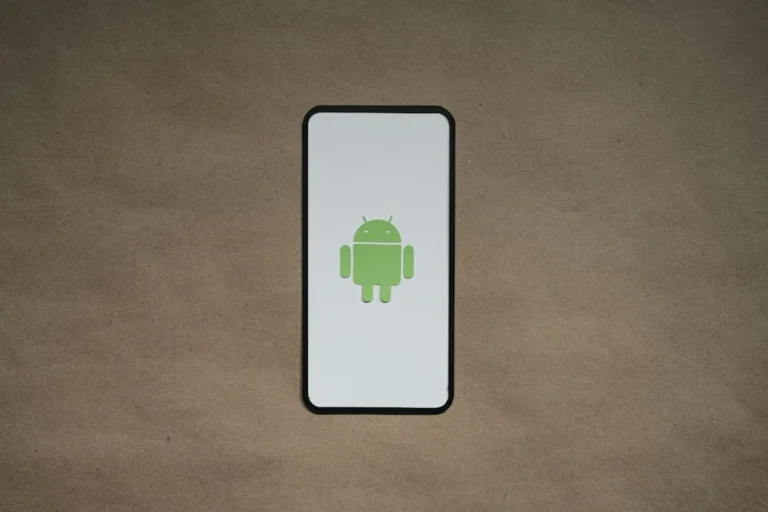 a cell phone with a green icon on it